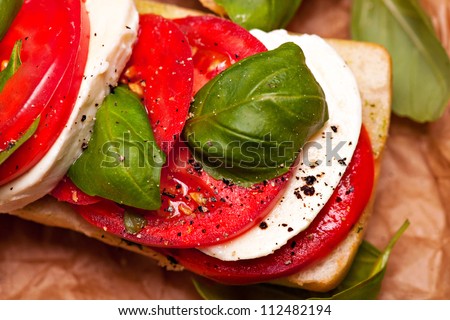 Italian ciabatta bread with mozzarella, tomatoes and basil
