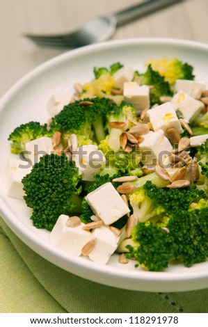 Delicious broccoli salad with goat cheese and sunflower seeds