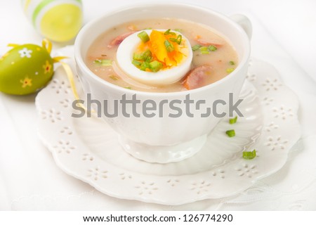 White borscht with eggs and white sausage. Polish traditional easter soup