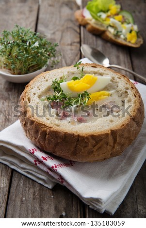 easter white borscht with eggs and sausage in bread bowl