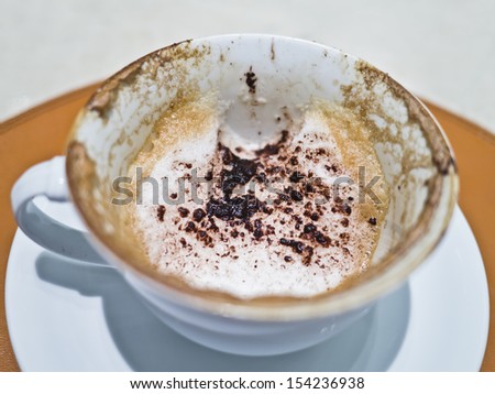 hot cappuccino on the table is run out, that's right for drink cappuccino
