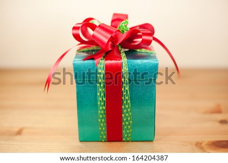 Gift wrapped present with red bow