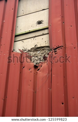 Grenade hole viewed on building as war aftermath, Sarajevo - Bosnia and Herzegovina