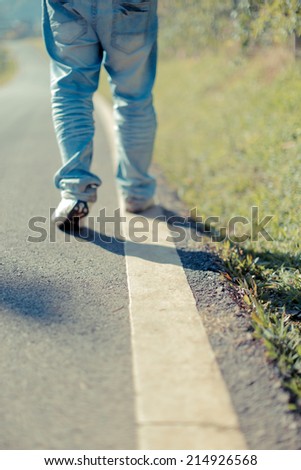 People walking a straight line on the road