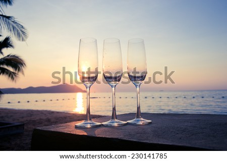 Glass of wine with evening light sea.