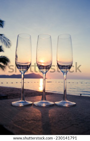 Glass of wine with evening light sea.