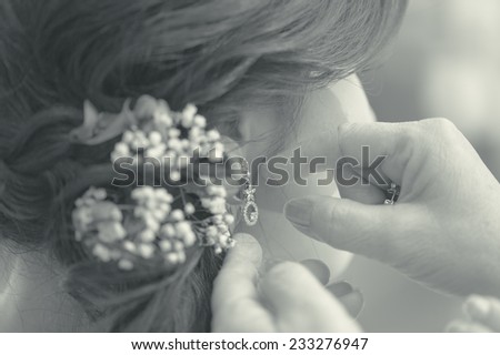 Bride wearing diamond earrings