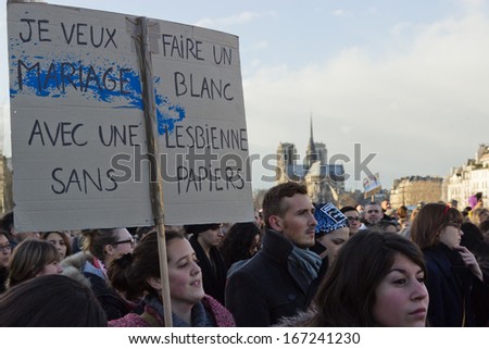 PARIS, FRANCE - JANUARY 27 : Woman holds a sign in Paris, France. Over 300 000 people walked in Paris that day. The sign says \