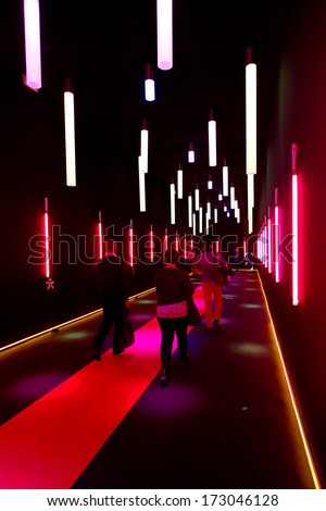 PARIS, FRANCE - JANUARY 24, 2014: People take a red corridor in between halls at Maison&Objet, the French leading professional trade show for home fashion in Paris,