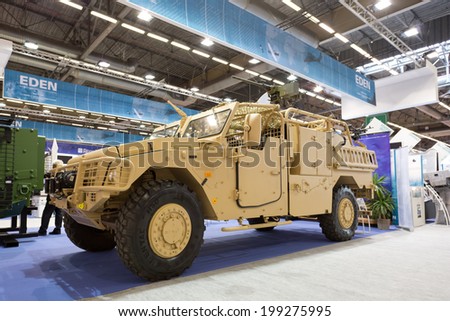 PARIS, FRANCE - JUNE 17, 2014: People visit stands at Eurosatory, the largest international land and air-land defence and security exhibition in Europe..