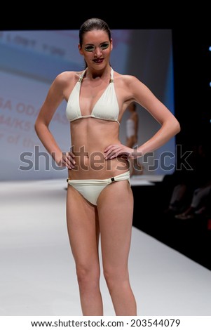 PARIS, FRANCE - JULY 5, 2014: Models walk the runway at Mode City, a swimwear and lingerie tradeshow where over 20,000 buyers meet 500 exhibitors from 35 different countries.