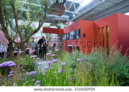 PARIS, FRANCE - SEPT; 5, 2014: An interior design with grass and flowers is on display at Maison et Objet, the French leading professional trade show for home fashion and design.