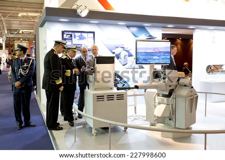 PARIS, FRANCE - OCTOBER 30, 2014: Military personnel attend a demo at Euronaval, a major Defense and Marine Military exhibition in Le Bourget near Paris, France.
