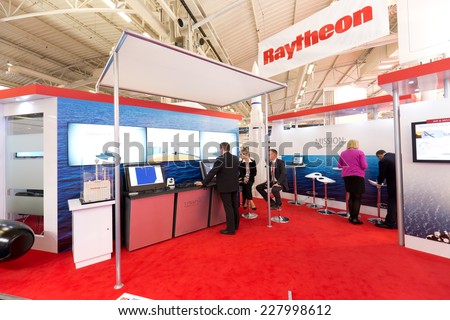 PARIS, FRANCE - OCTOBER 30, 2014: People visit stands at Euronaval, a major Defense and Marine Military exhibition in Le Bourget near Paris, France.