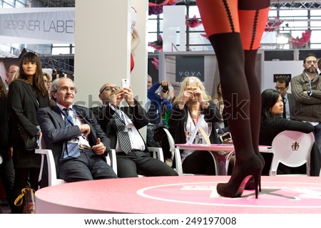 PARIS, FRANCE - JAN. 25, 2015: Buyers watch models walk the runway at the International Lingerie Show in Paris where over 20,000 buyers meet 500 exhibitors from 37 different countries.