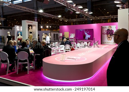 PARIS, FRANCE - JAN. 25, 2015: People wait for a show to begin at the International Lingerie Show in Paris where over 20,000 buyers meet 500 exhibitors from 37 different countries.