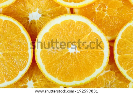 Background made of heap fresh orange slices