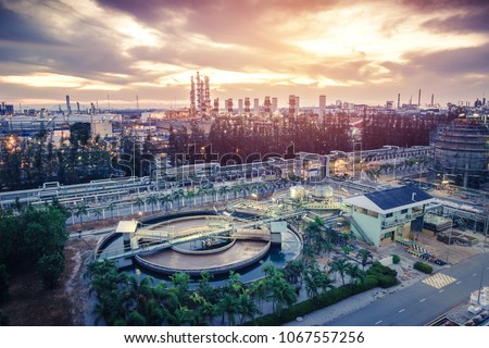 Petrochemical industrial estate on sunrise sky background with Wastewater treatment plant