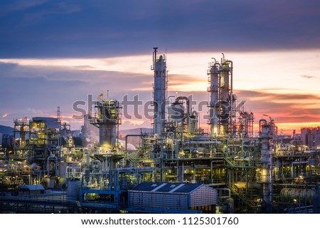 Oil and gas refinery plant or petrochemical industry on sky sunset background, Factory at evening, Manufacturing of petroleum industrial plant