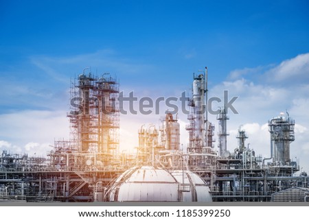 Gas distillation tower and gas storage tanks of Petroleum industrial on blue sky background, Manufacturing of petrochemical industrial plant