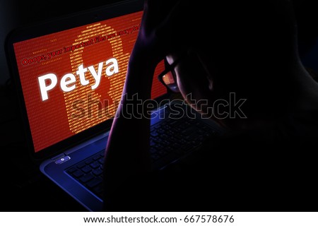 Petya ransomware attack on notebook screen,cyber attack internet security concept