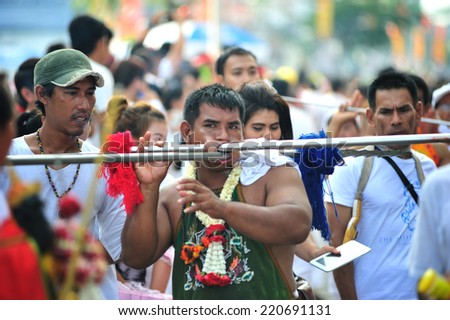 PHUKET, THAILAND - SEPTEMBER 30: A typical scene of Thai Chinese worshippers waiting for the parade of the Phuket Vegetarian Festival in Phuket Town, Phuket, Thailand on the 30th September, 2014.
