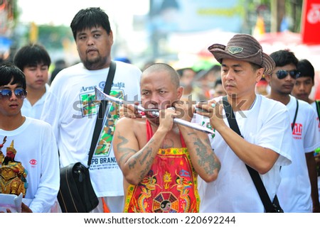 PHUKET, THAILAND - SEPTEMBER 30: A typical scene of Thai Chinese worshippers waiting for the parade of the Phuket Vegetarian Festival in Phuket Town, Phuket, Thailand on the 30th September, 2014.