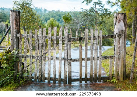 Old wooden fence and gate at a farm