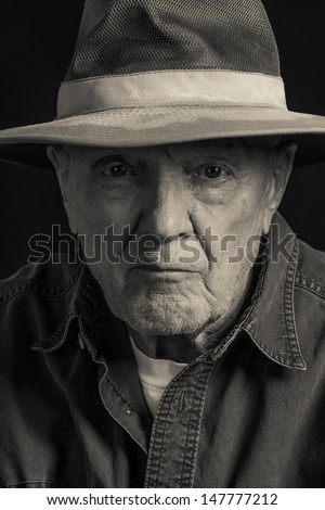 Stern Man Wears Hat