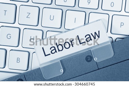 Labor Law - folder on computer keyboard in the office