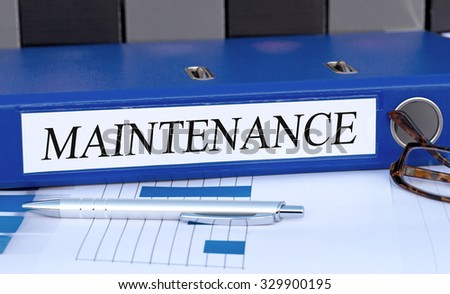 Maintenance - blue binder with text in the office