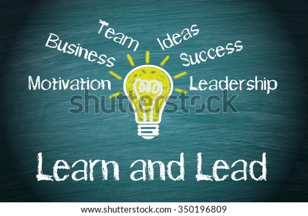 Learn and Lead Business Concept with light bulb and text on green background