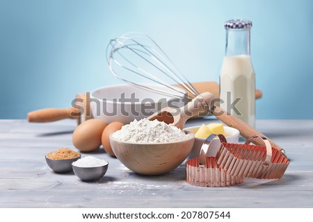 ingredients and tools to make cookies, flour, butter, sugar,egg, milk
