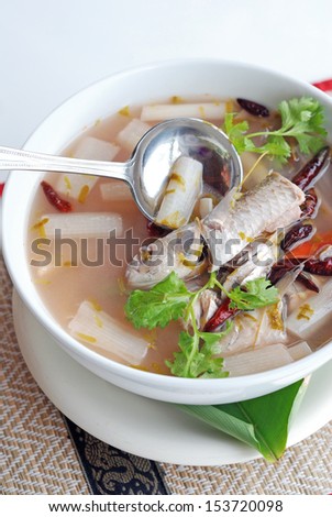 fish sour soup with banana stalk and tamarind leaves Thai cuisine