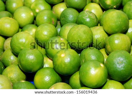 lime fruit heap in market food background