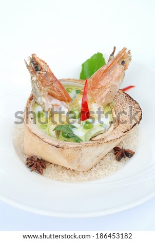 prawn green curry serves in coconut fruit