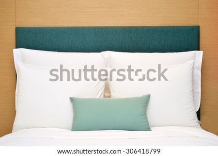 pillow set on bed in the room