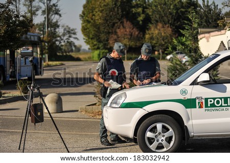 LODI, ITALY - OCTOBER 3: Checkpoint control and alcohol during a demonstration in the city of Lodi, Italy on October 3, 2011. Monitoring police Safety Camera
