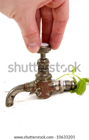 Hand turning off the tap with oil. Now only green energy.