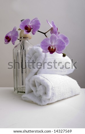 Towels, orchids and soda on luxury spa