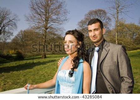 ethnic couple at engagement or wedding. young turkish people together in love with blue dress and suit
