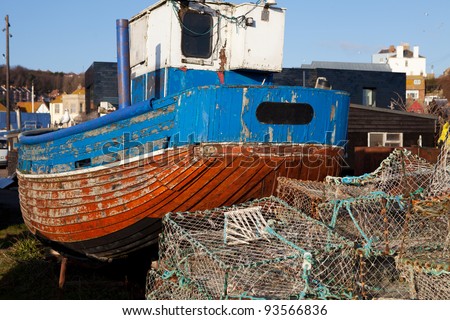 fishing industry, trawler or fishing boat on the beach in seaside resort of Hastings in England. South UK shoreline