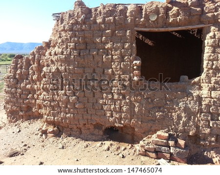 Window of dilapidated mud house in South Africa