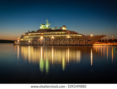 Modern cruise liner in the harbor at night