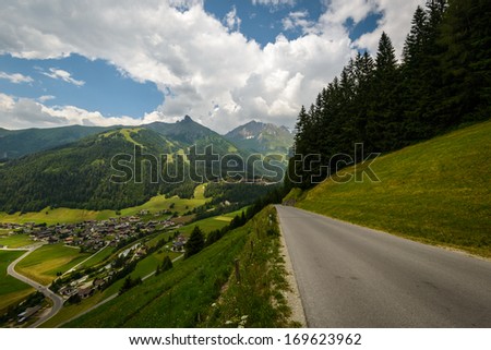 Beautiful landscape with village and road in the austrian alps.