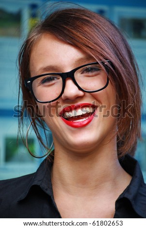 Beautiful teacher with glasses and red lipstick.