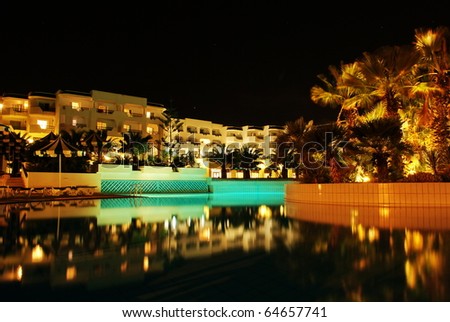 Swimming pool in luxury hotel at night.