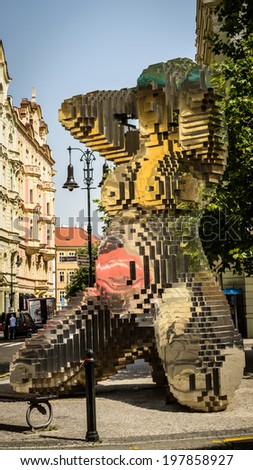 PRAGUE, CZECH REPUBLIC - MAY 23, 2014: Sculpture of six meter naked woman  made from stainless steel, by famous Czech sculptor David Cerny in 2013.