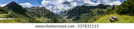Mountain summer panorama with green Alps hills in background and relaxing place in foreground.Styria,Austria.
