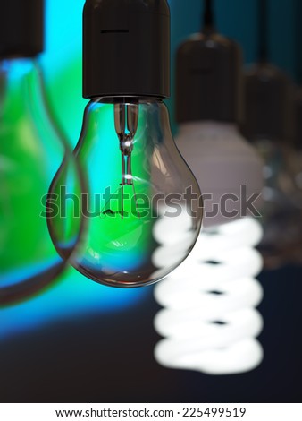 Old-fashioned incandescent light bulb among glowing energy efficient one